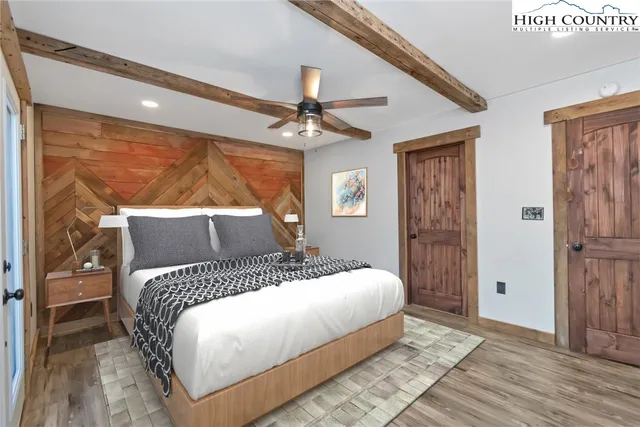 a view of an empty room window and wooden floor