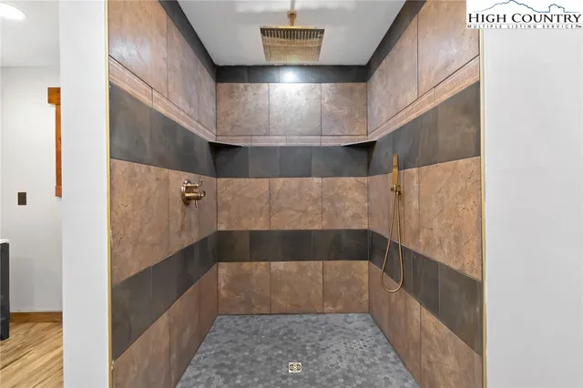 an aerial view of residential house with an outdoor space and seating