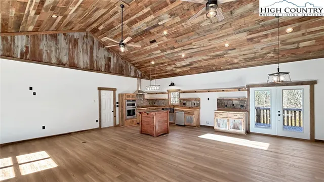 a kitchen with stainless steel appliances a stove and a cabinets