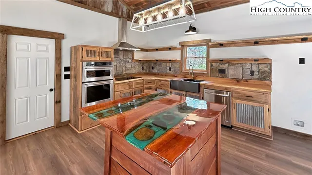 a view of a kitchen with a dishwasher and cabinets