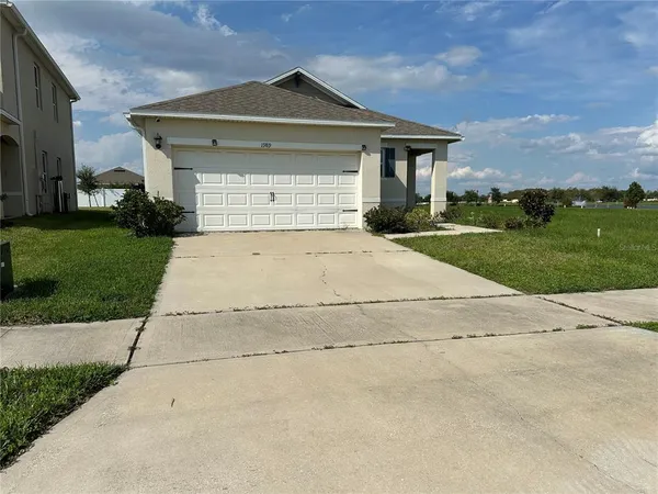 front view of house with a yard