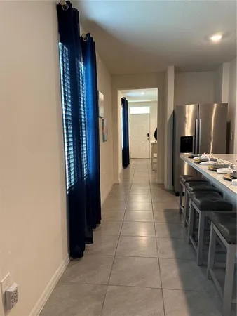 a kitchen with stainless steel appliances a refrigerator and a stove