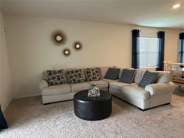 a living room with furniture and a couch