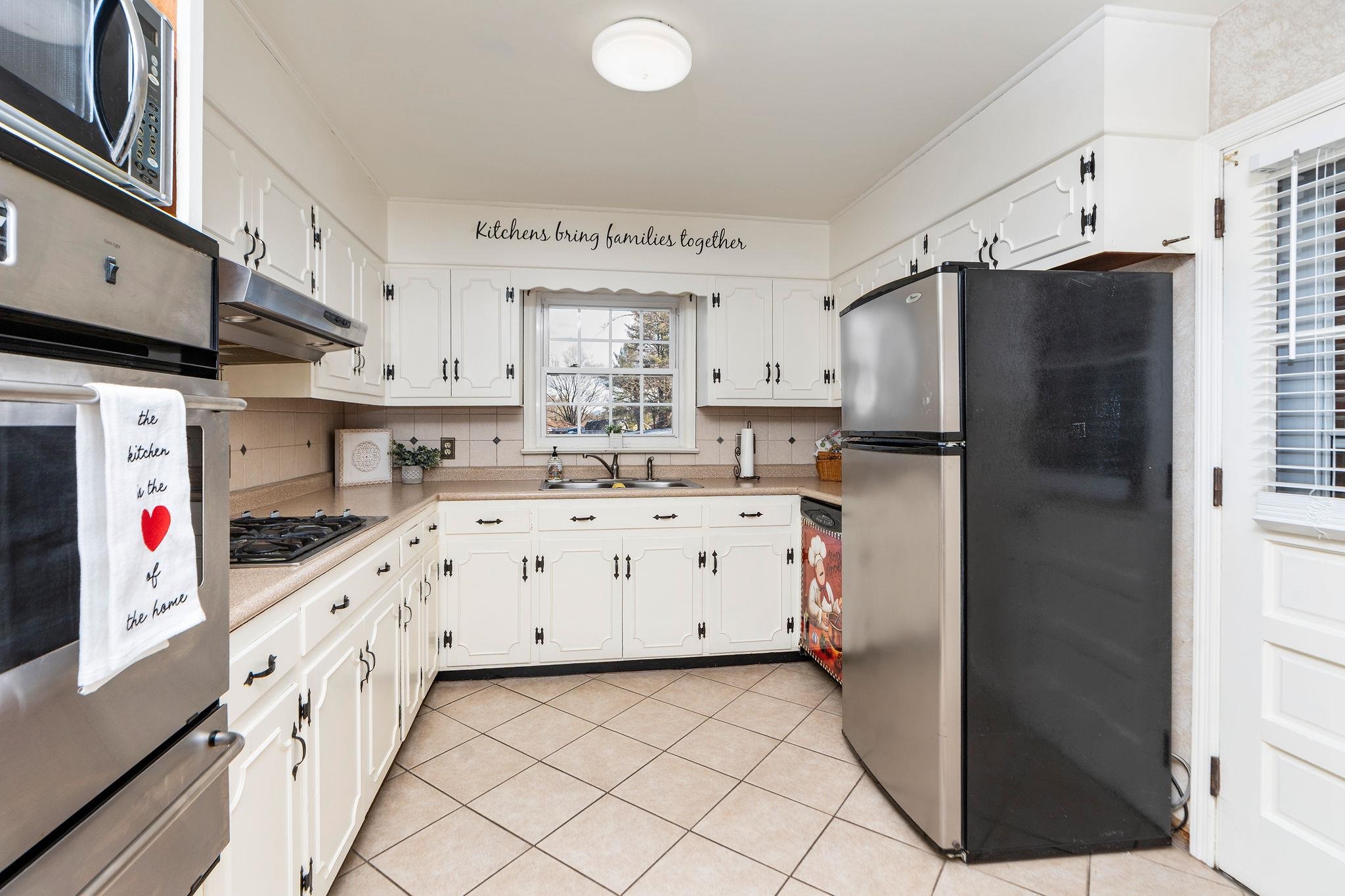 2 McCormick Street Lexington, VA 24450 - Photo 16 of 69 a kitchen with stainless steel appliances a stove a sink and a refrigerator