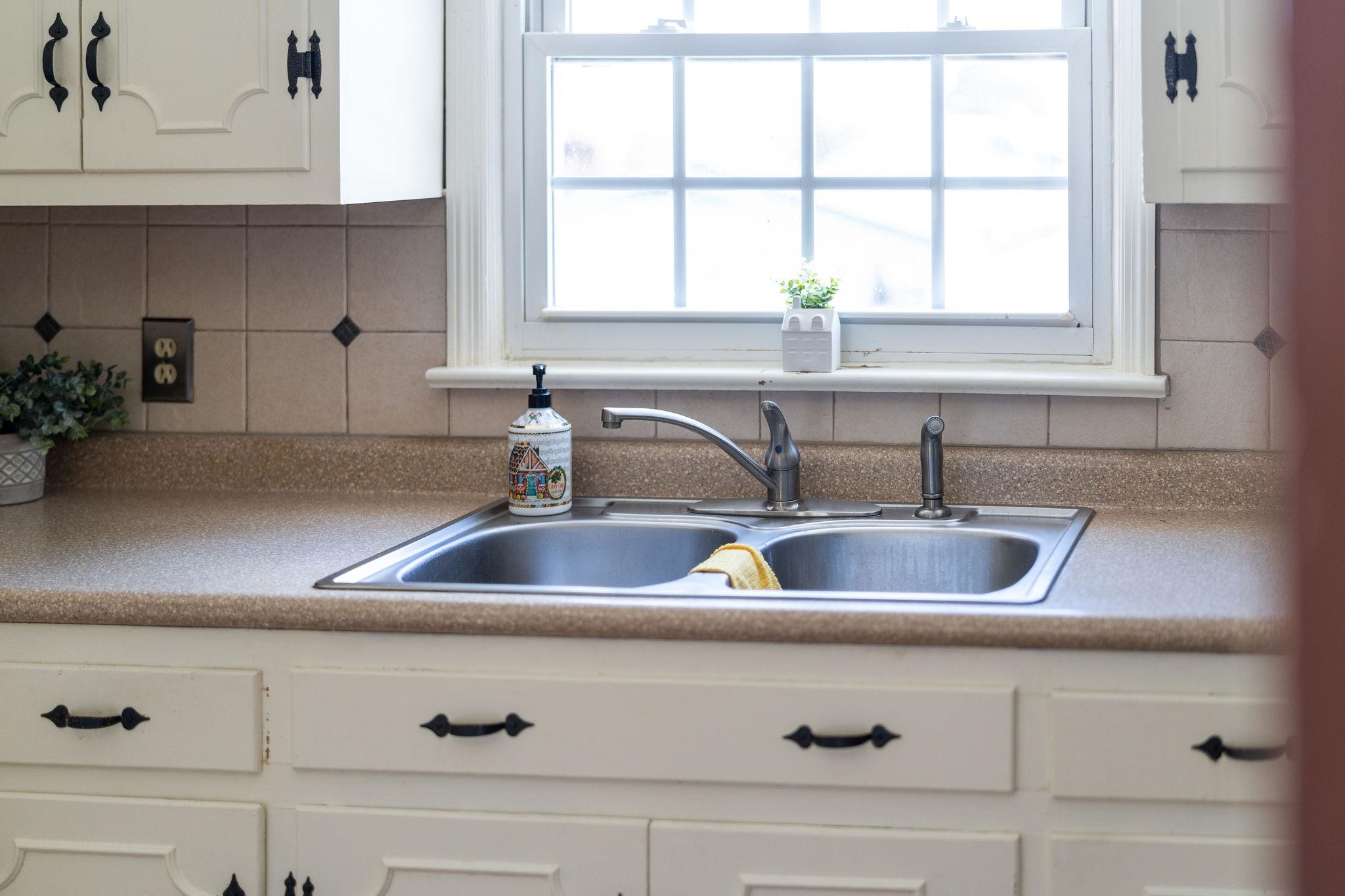 2 McCormick Street Lexington, VA 24450 - Photo 21 of 69 a kitchen with sink a window and cabinets