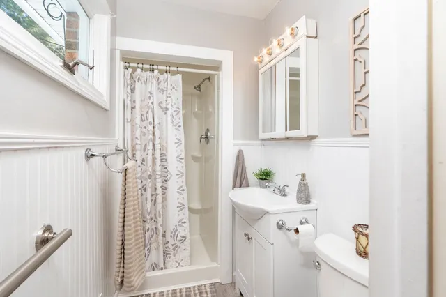 a bathroom with a sink a mirror and a bathtub