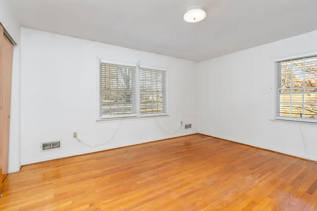 a view of a livingroom with furniture and a window