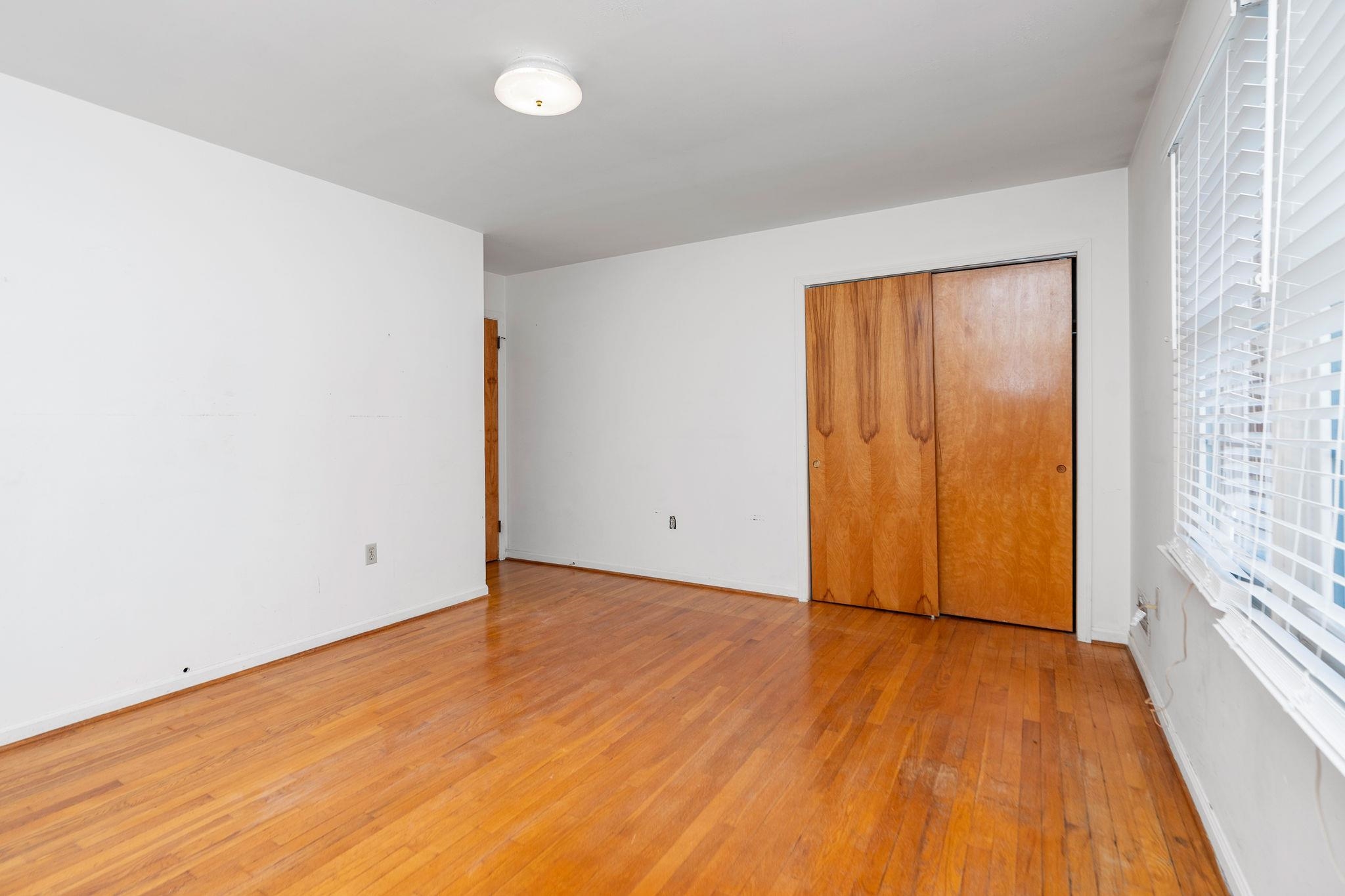 2 McCormick Street Lexington, VA 24450 - Photo 28 of 69 an empty room with wooden floor and windows