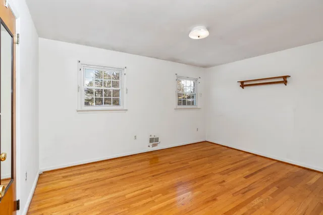 a view of a livingroom with furniture and windows