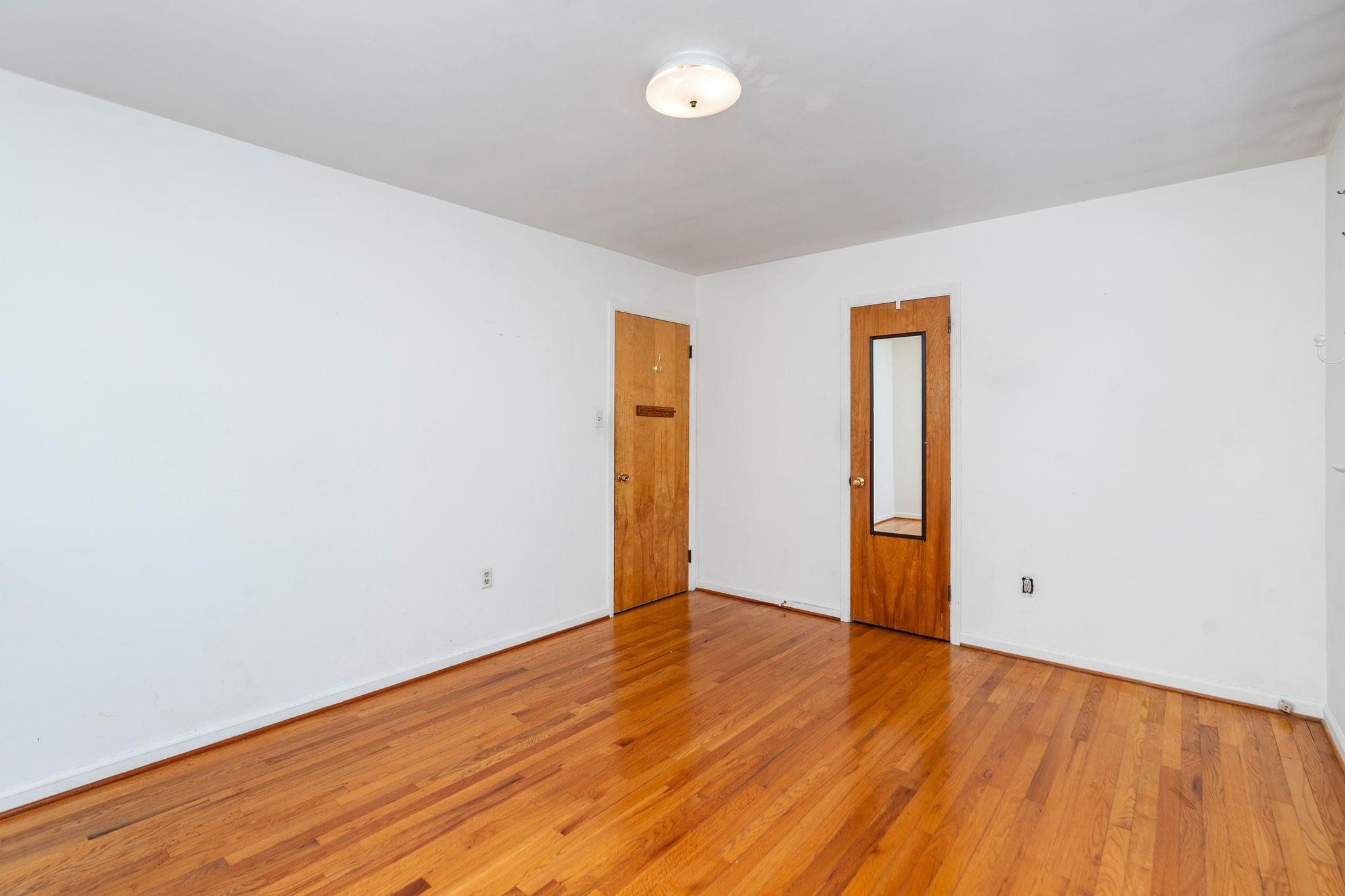 2 McCormick Street Lexington, VA 24450 - Photo 30 of 69 an empty room with wooden floor and windows