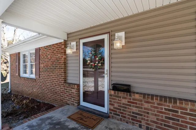 a spacious bedroom with a bed and a window