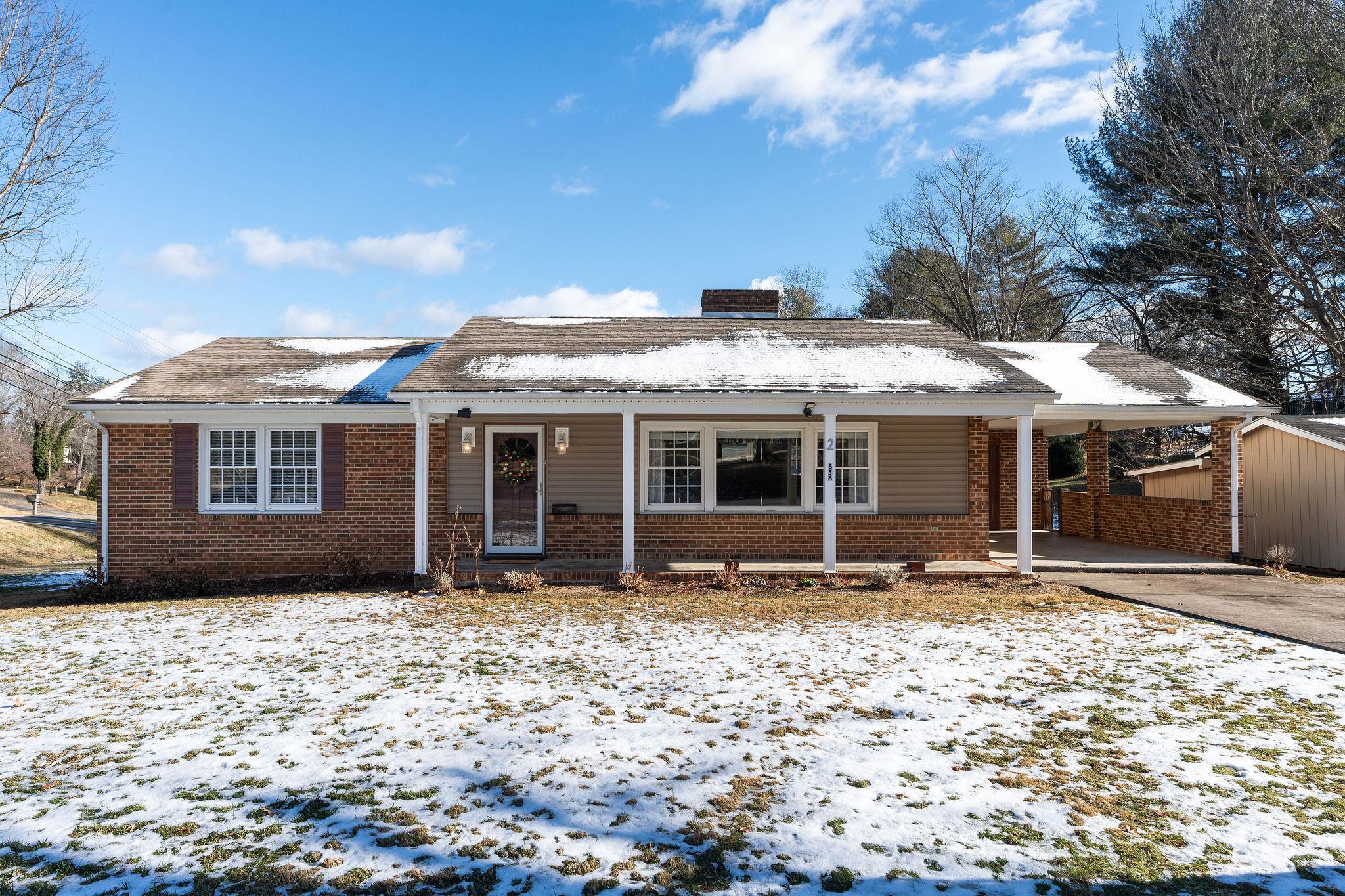 2 McCormick Street Lexington, VA 24450 - Photo 44 of 69 a front view of a house with a garden
