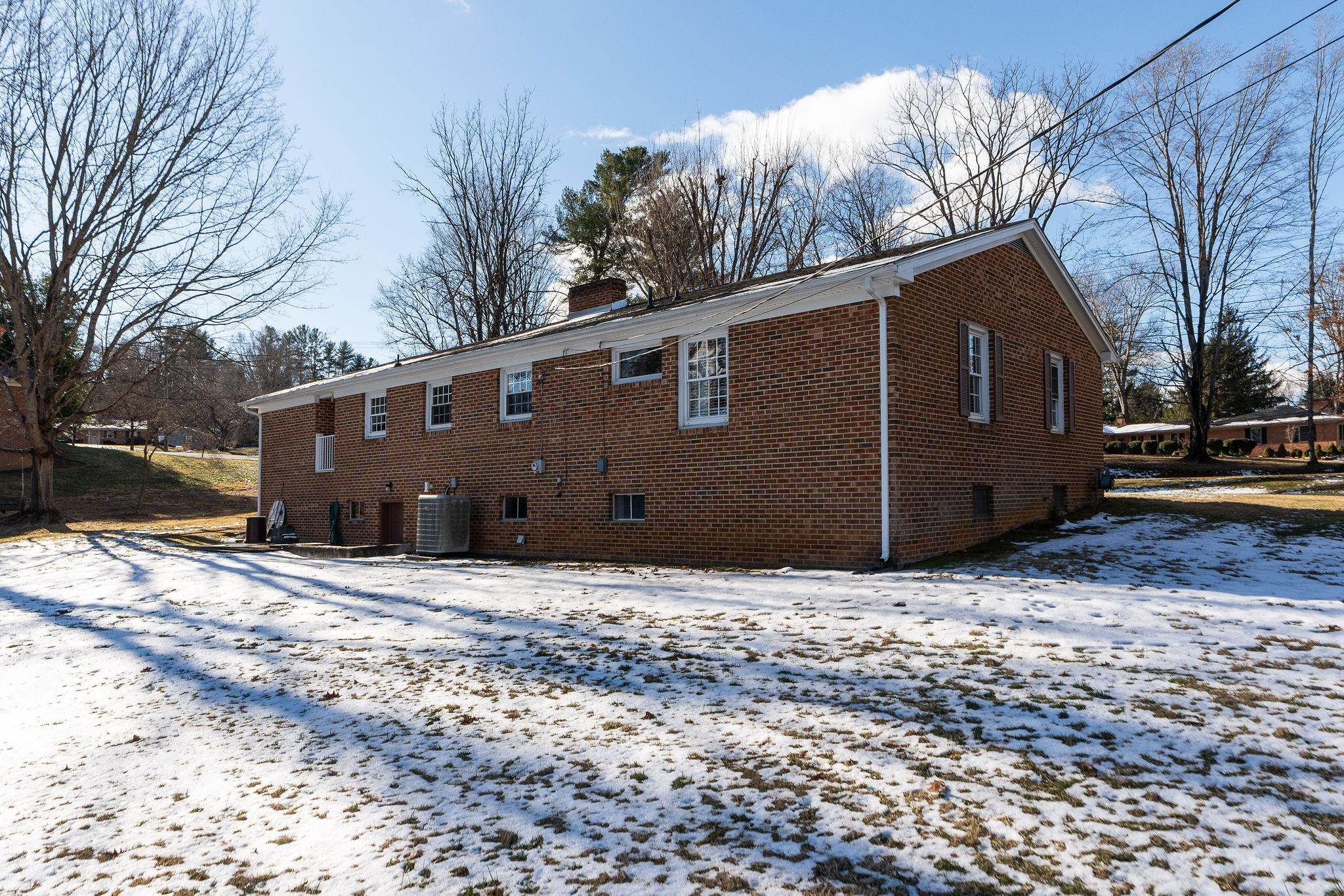 2 McCormick Street Lexington, VA 24450 - Photo 50 of 69 a house view with a yard covered with snow in front of house