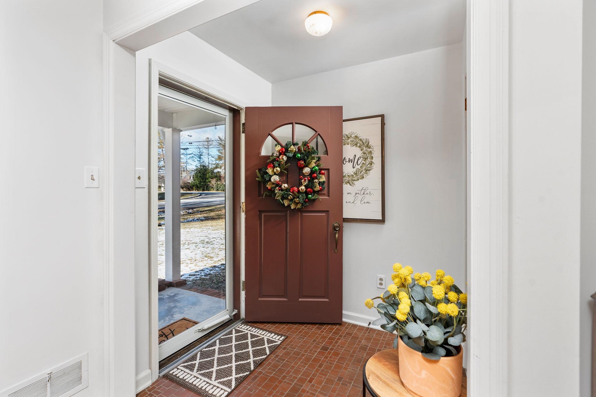 2 McCormick Street Lexington, VA 24450 - Photo 5 of 69 a view of a hallway with wooden floor and a potted plant