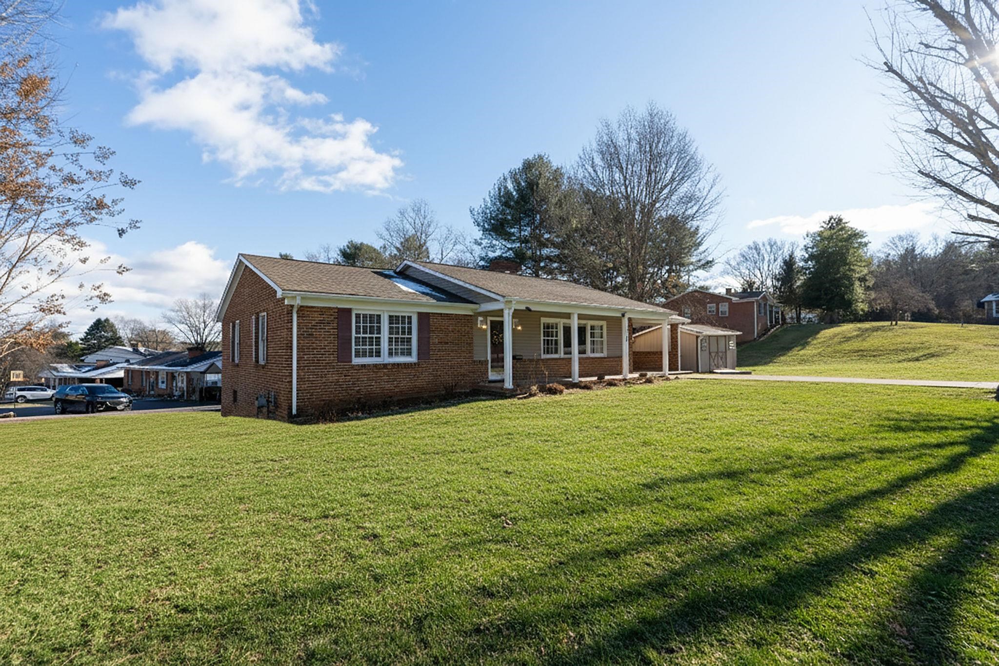 2 McCormick Street Lexington, VA 24450 - Photo 52 of 69 a front view of a house with a yard