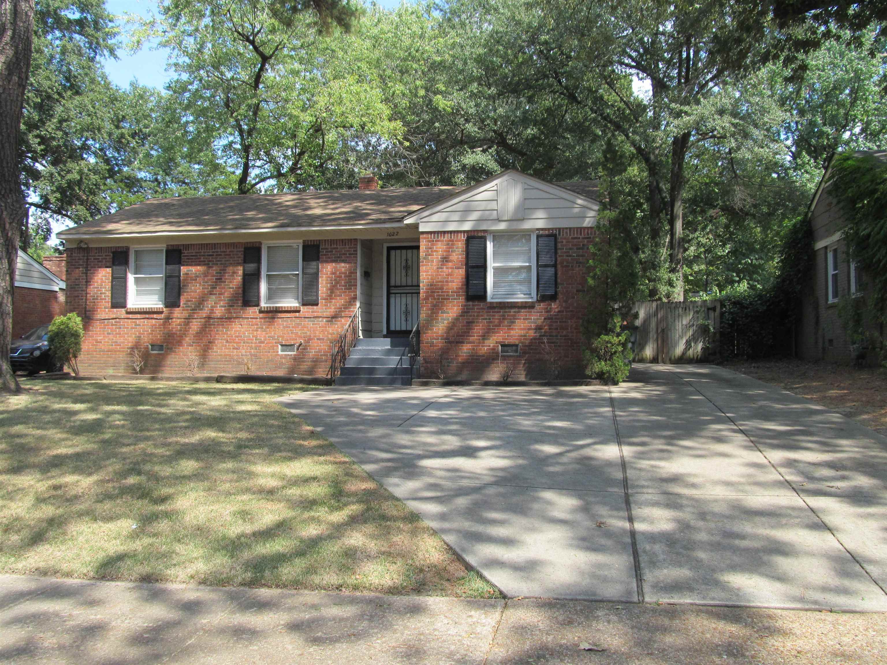 1022 South White Station Road Memphis, TN 38117 - Photo 1 of 14 a front view of a house with garden