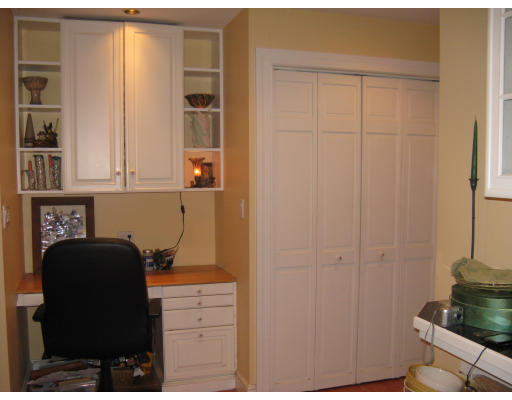29 Sevinor Road Marblehead, MA 01945 - Photo 4 of 15 a kitchen with a refrigerator and cabinets