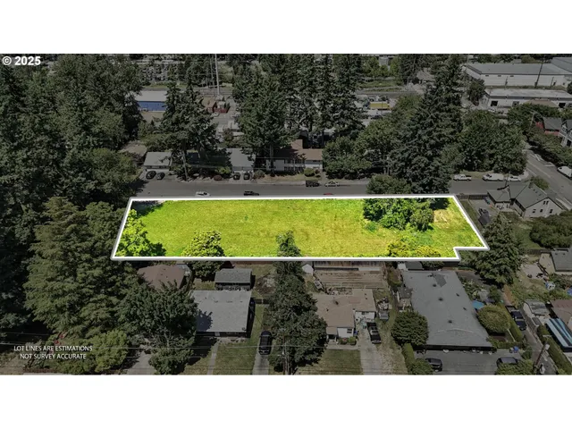a back yard with a sink and garden in the background
