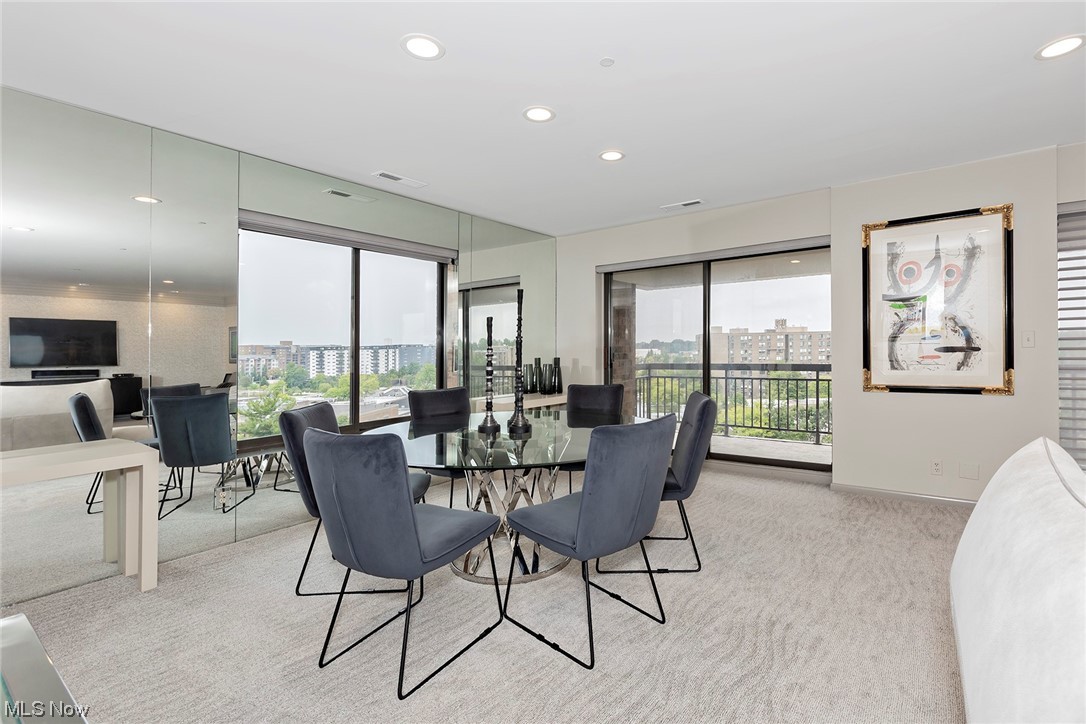 27500 Cedar Road, Unit 608 Beachwood, OH 44122 - Photo 8 of 34 Dining area has a huge picture window and sliding glass door with access to the balcony.