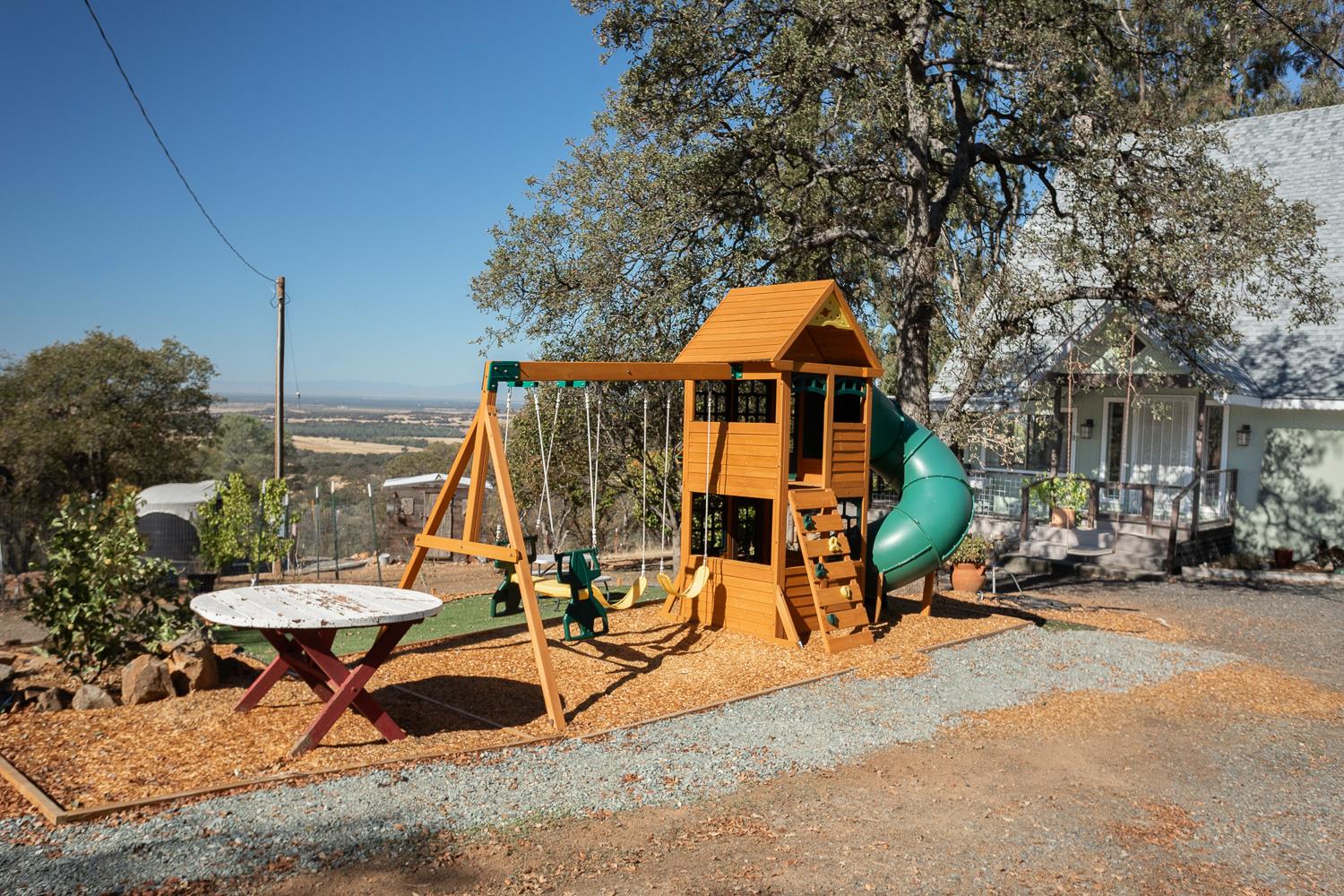 135 Sunny Hills Bangor, CA 95901 - Photo 26 of 35 a view of a park with chairs and iron fence