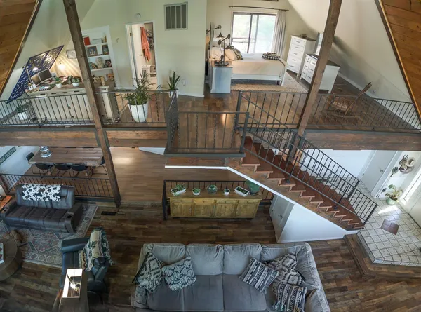 a view of a balcony with wooden floor
