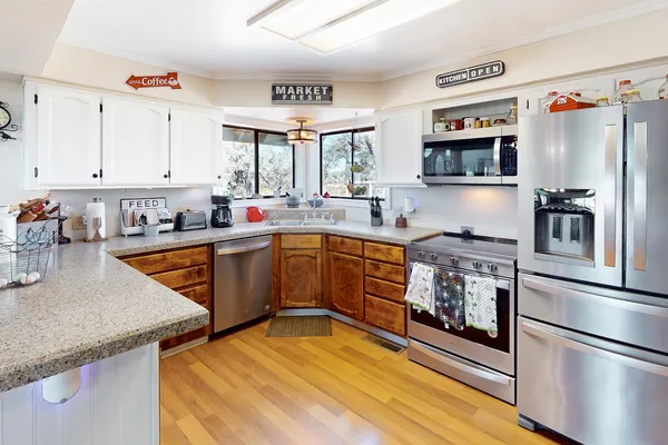 a kitchen with counter space cabinets and appliances