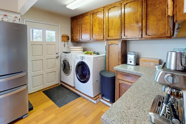 a spacious bedroom with a bed and a flat screen television