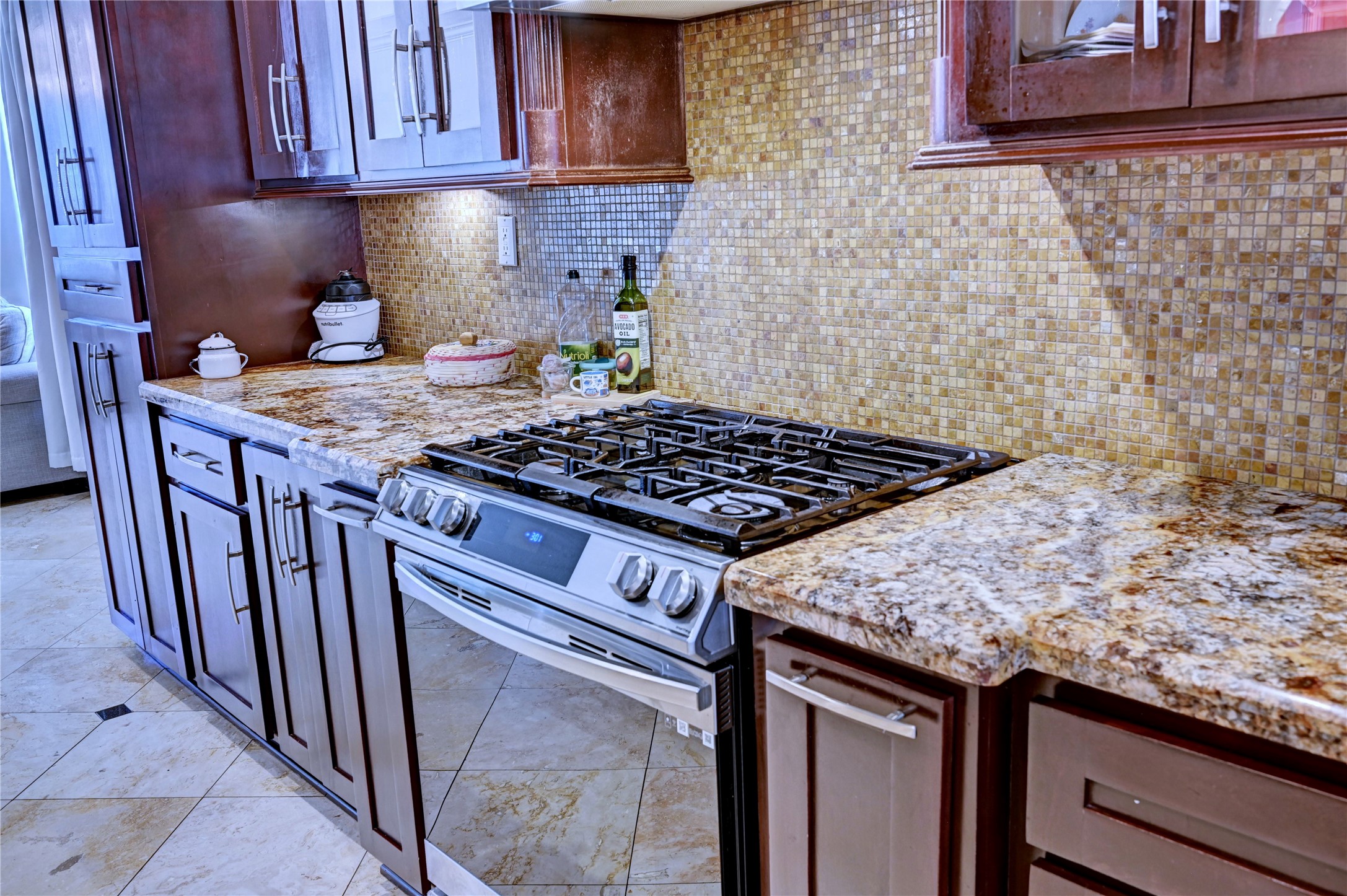 2012 Forest Hill Boulevard Houston, TX 77023 - Photo 16 of 50 a kitchen with granite countertop a stove sink and cabinets