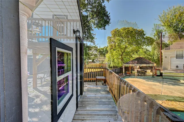 a bedroom with furniture and a wooden floor