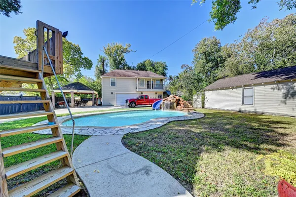 a view of a backyard with a patio