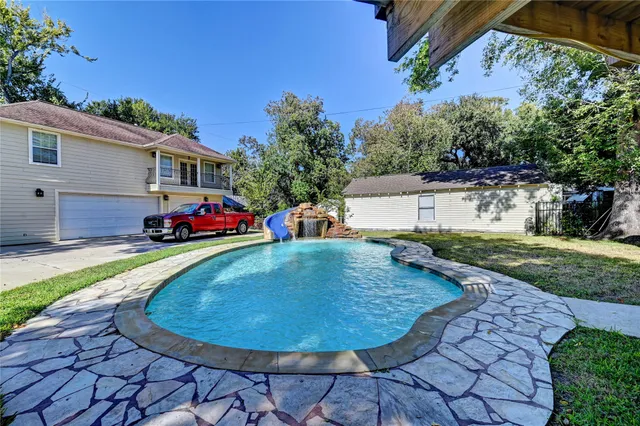 a view of a backyard with a patio