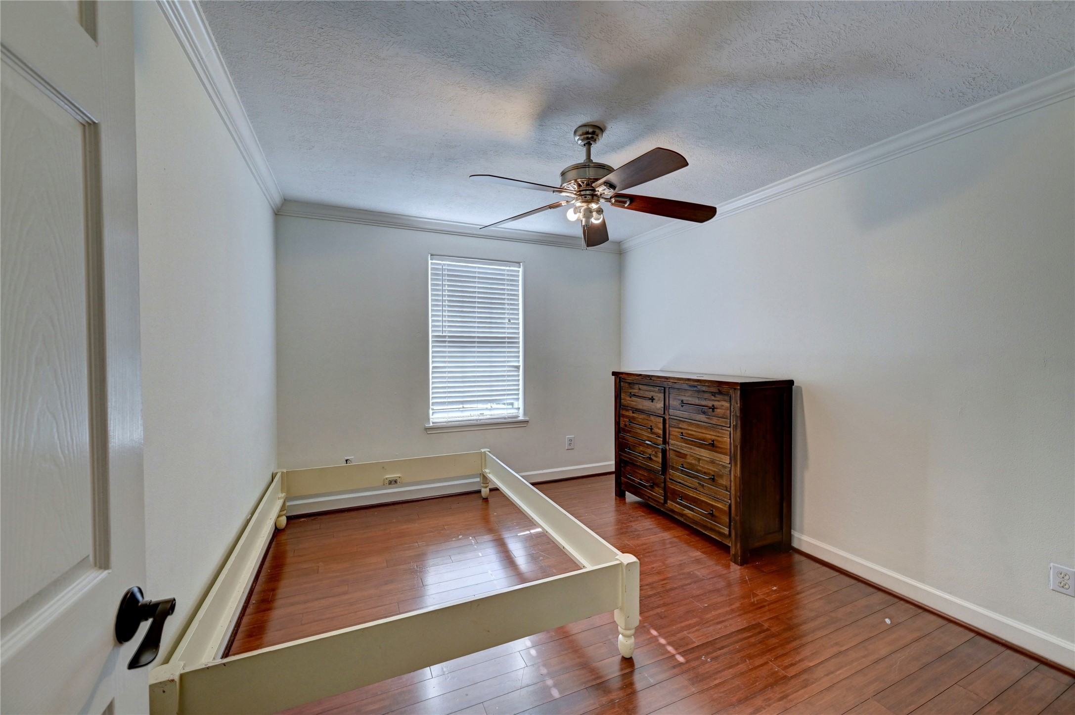2012 Forest Hill Boulevard Houston, TX 77023 - Photo 45 of 50 an empty room with windows and ceiling fan