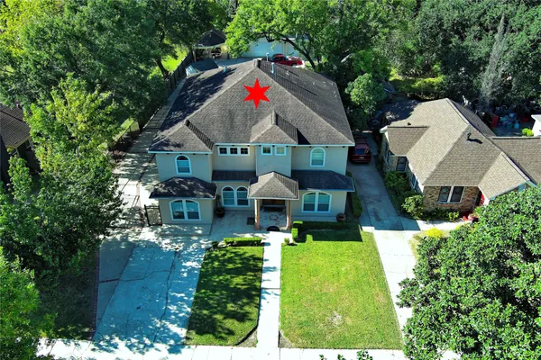 an aerial view of residential house with outdoor space and swimming pool