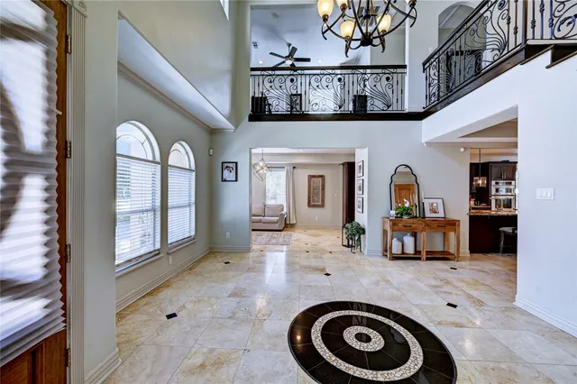 a view of living room kitchen and front door