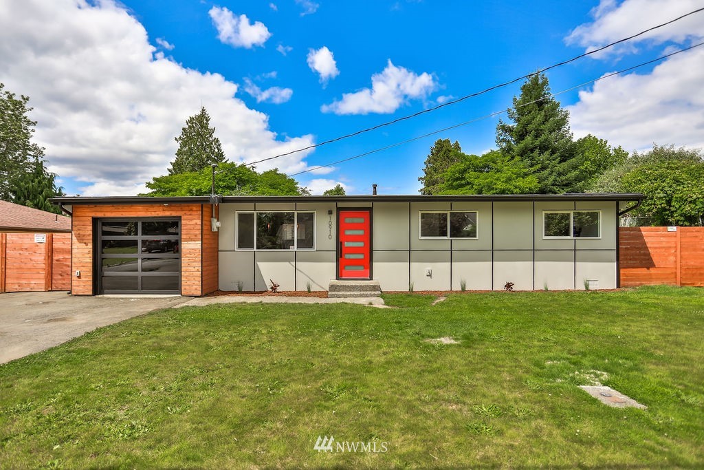 10910 Southeast 181st Street Renton, WA 98055 - Photo 2 of 32 a front view of a house with a garden