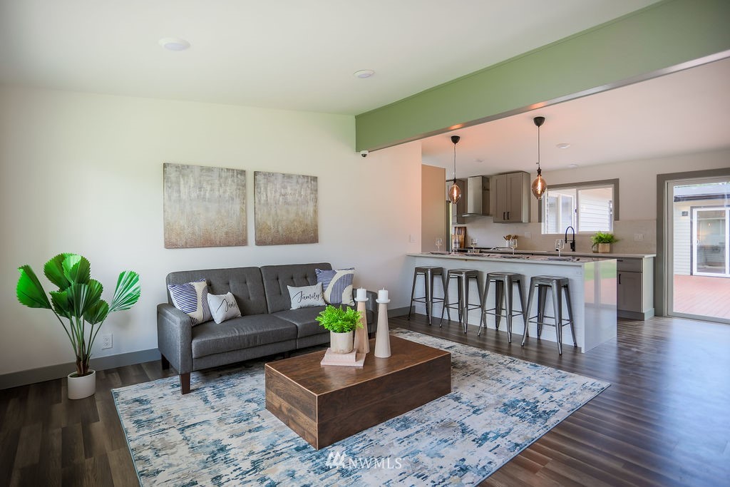 10910 Southeast 181st Street Renton, WA 98055 - Photo 11 of 32 a living room with furniture and wooden floor