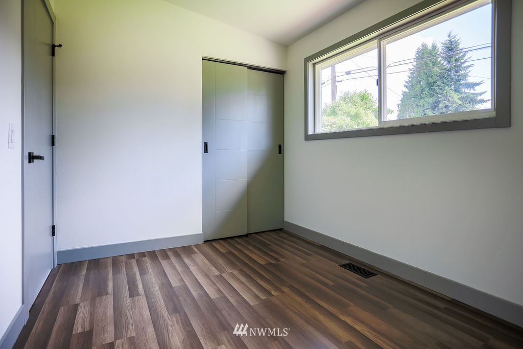10910 Southeast 181st Street Renton, WA 98055 - Photo 21 of 32 a view of room with window and hardwood floor