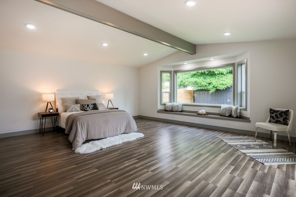 10910 Southeast 181st Street Renton, WA 98055 - Photo 26 of 32 a bedroom with a large bed and a large window