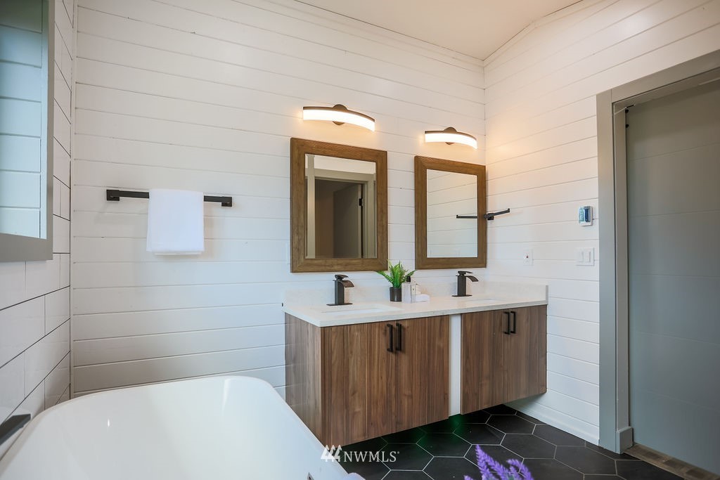 10910 Southeast 181st Street Renton, WA 98055 - Photo 29 of 32 a bathroom with a sink and a mirror