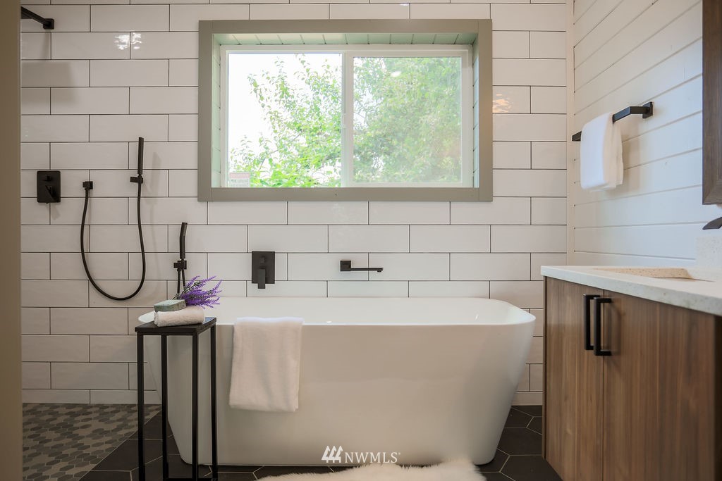 10910 Southeast 181st Street Renton, WA 98055 - Photo 30 of 32 a bathroom with a sink a toilet and vanity