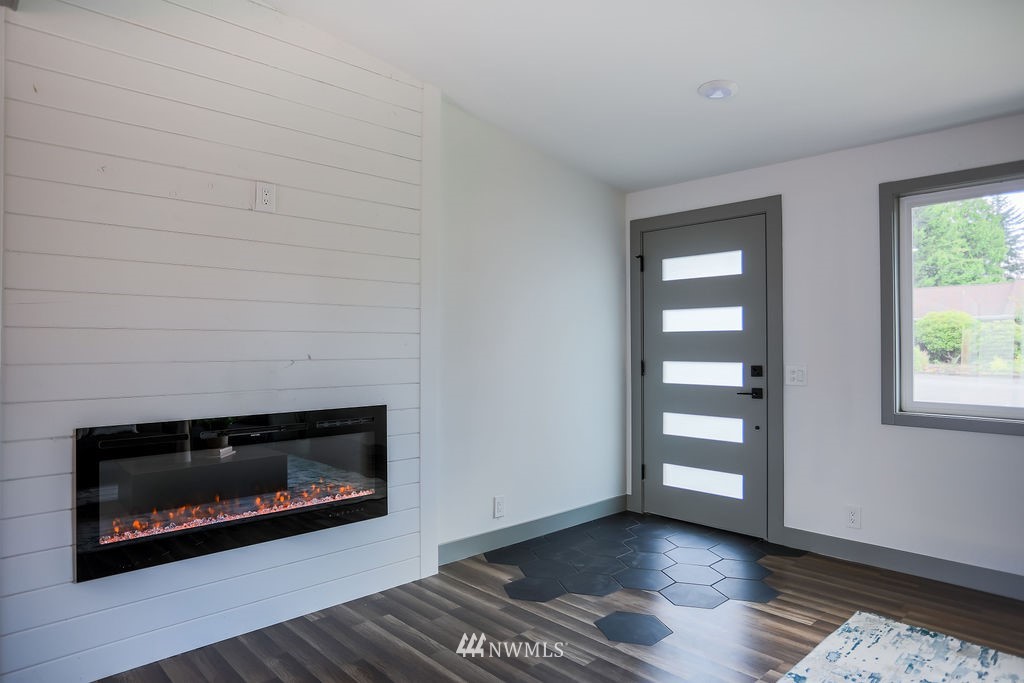 10910 Southeast 181st Street Renton, WA 98055 - Photo 10 of 32 a living room with a fireplace