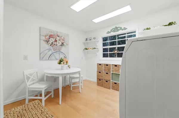 a kitchen with stainless steel appliances granite countertop a sink a stove counter space and cabinets