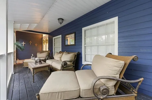 a view of a chairs and table on the deck