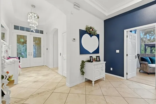 a bed room with a bed and a chair