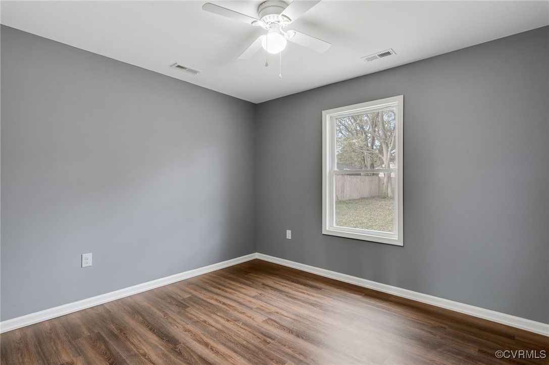4436 Angus Road Richmond, VA 23234 - Photo 15 of 24 Unfurnished room with ceiling fan and wood-type fl