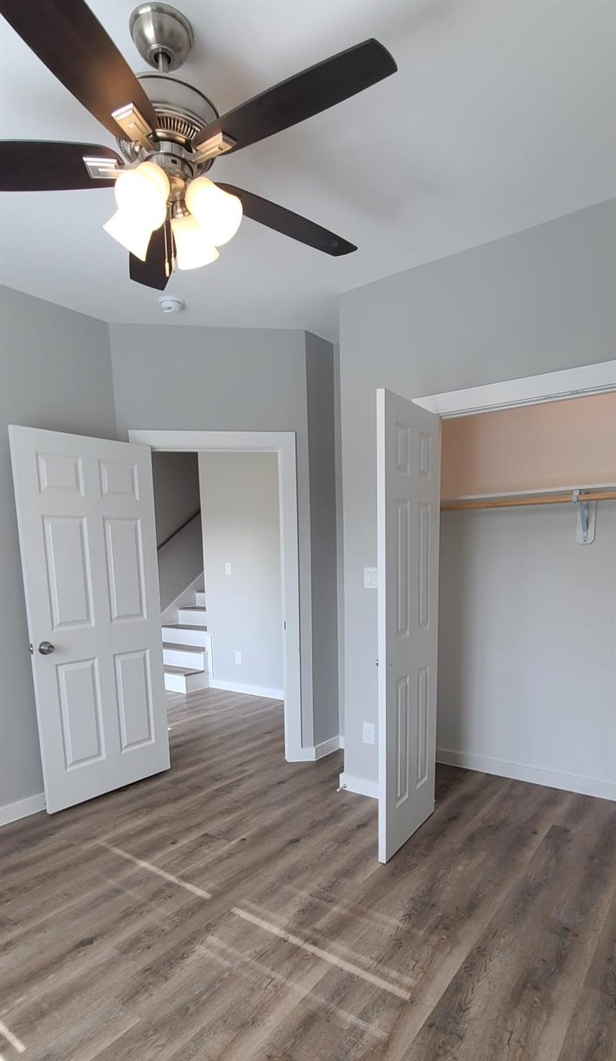 9114 Caddo Road, Unit A & B Houston, TX 77078 - Photo 6 of 24 An inviting room features resilient vinyl plank flooring and a modern ceiling fan.