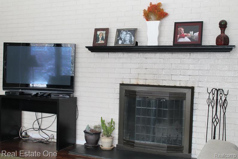3917 Normandy Road Royal Oak, MI 48073 - Photo 5 of 26 Natural fireplace surrounded by brick wall