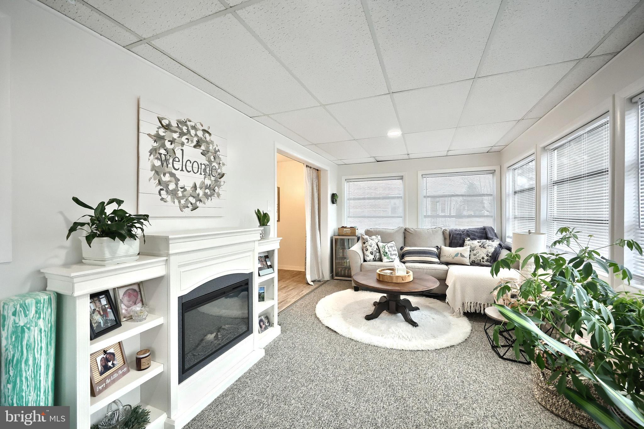 56 York Road York, PA 17407 - Photo 14 of 45 a living room with furniture potted plant and a fireplace
