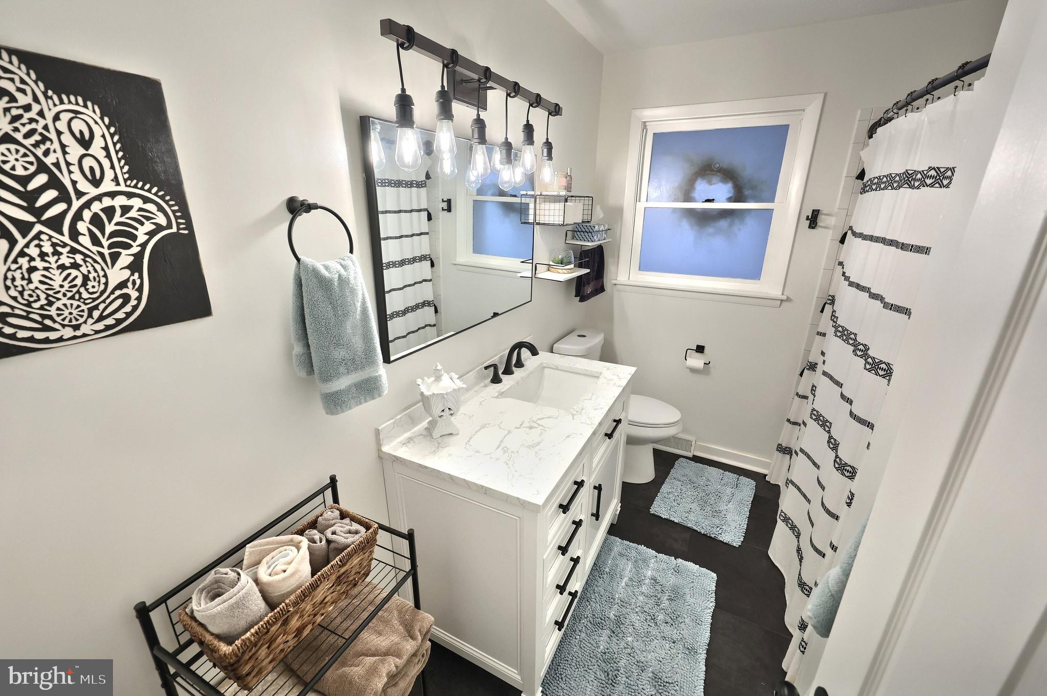 56 York Road York, PA 17407 - Photo 21 of 45 a bathroom with a sink toilet and mirror