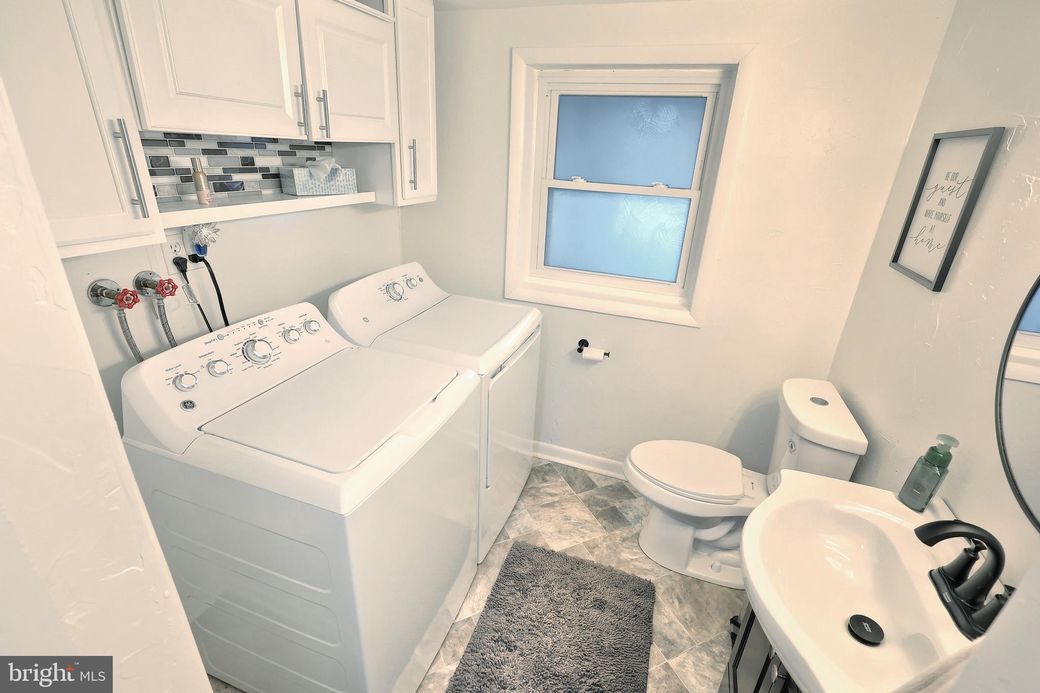 56 York Road York, PA 17407 - Photo 27 of 45 a white toilet sitting next to a bathroom sink